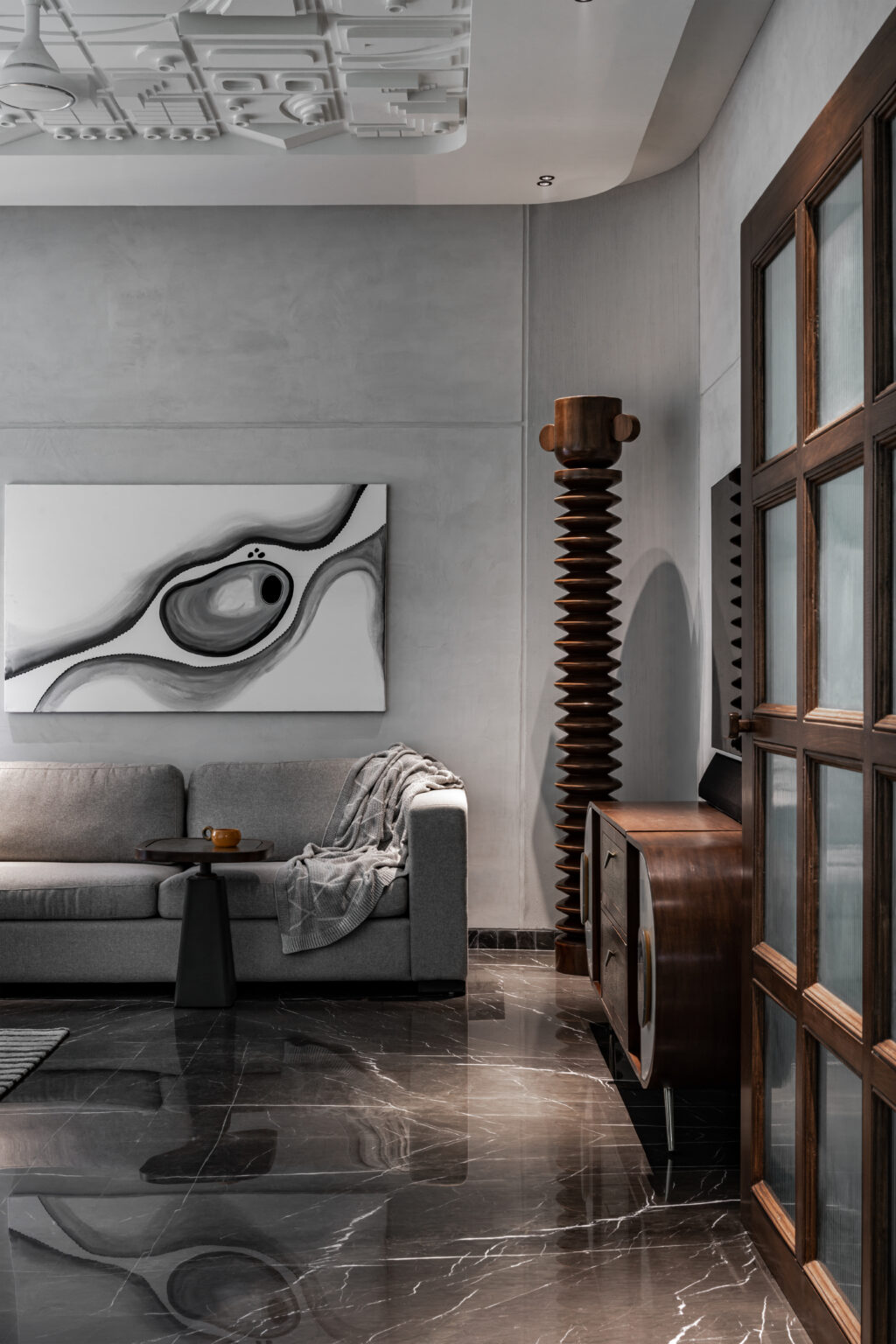 Cordkraft Design Studio’s LAAD-5 in Ahmedabad is a monochrome retreat defined by a handcrafted ceiling mural